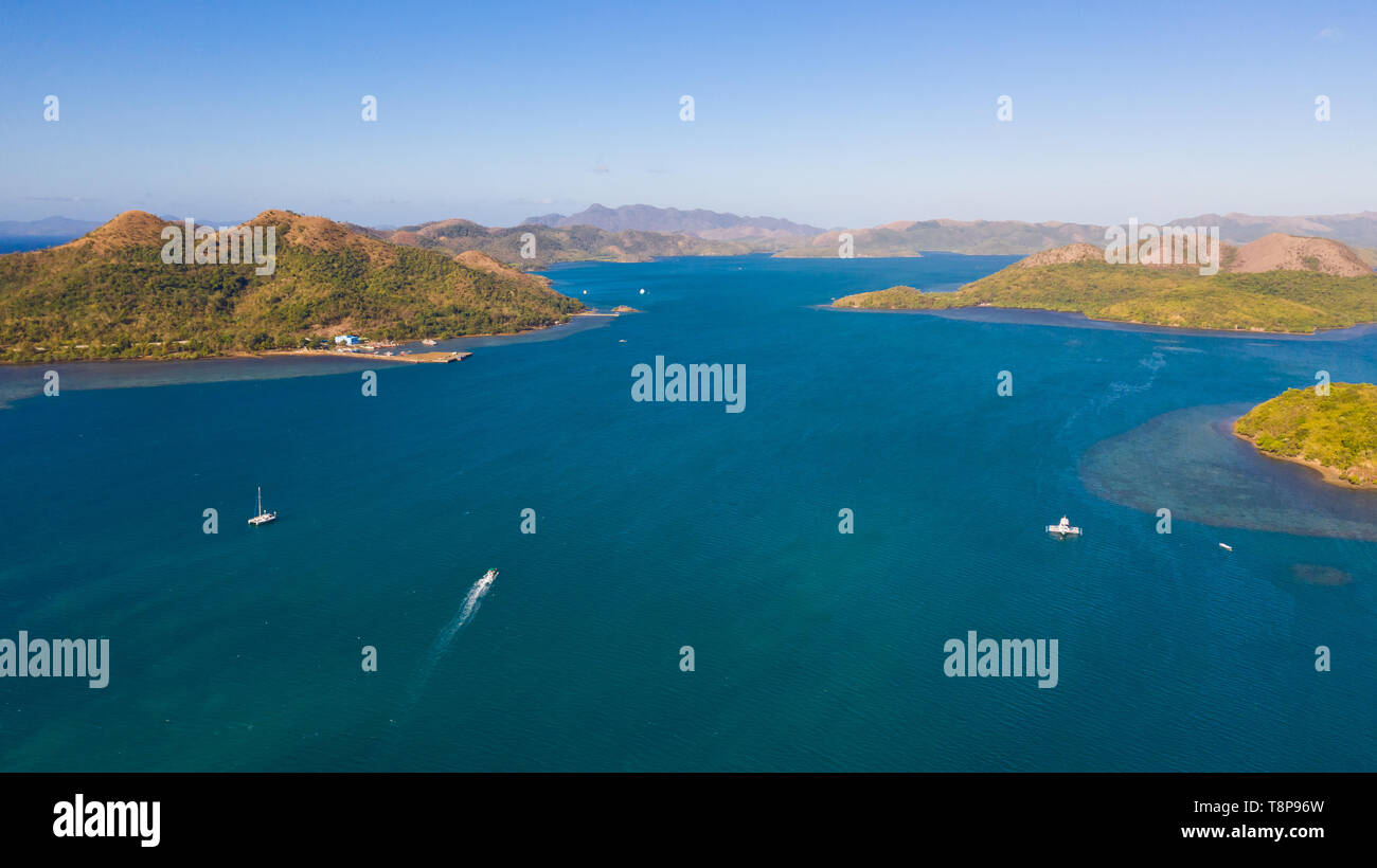 Seascape with islands. Blue sea and green islands, view from above.Boats ply between islands. Stock Photo
