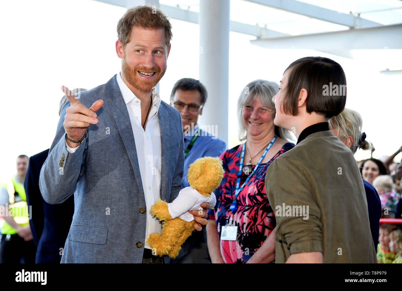 The Duke of Sussex is gifted a teddy bear by former patient Daisy Wingrove during a visit to Oxford Children's Hospital, based at the John Radcliffe hospital site in Oxford. Stock Photo