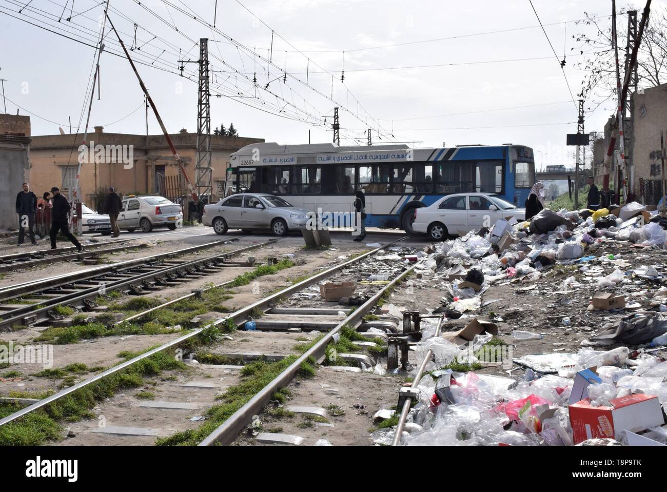 Railway, railroad crossing and garbage on 31.03.2019 in Tebessa - Algeria. | usage worldwide Stock Photo