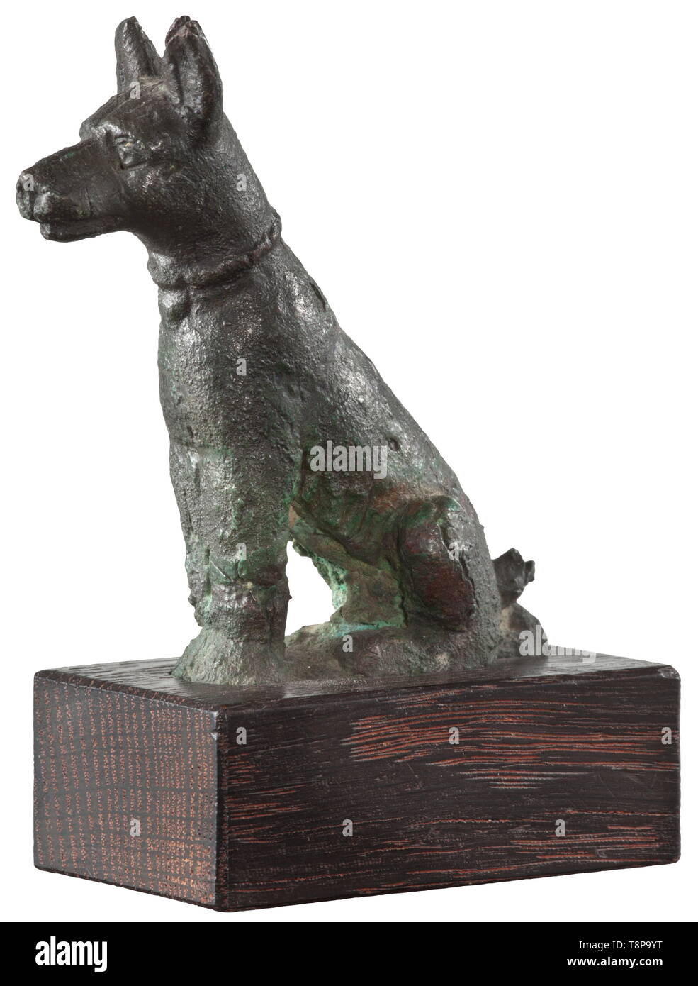 An ancient Egyptian bronze statue of Anubis as canid, late period, mid to late 1st millennium BC Figure of the god as sitting canid with a collar around his neck. Surface slightly corroded. Modern wood base. Height without base 7.5 cm. Provenance: 1970s private collection from the Munich area. historic, historical, ancient world, Additional-Rights-Clearance-Info-Not-Available Stock Photo