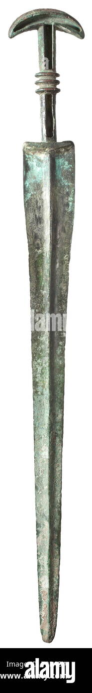 A bronze sword, Eastern part of Western Asia, late 2nd millennium BC Blade with distinctive central ridge tapering towards the blunt point, slender foible, the forte widening towards the grip. Recessed grip for the insertion of grip shells (now missing), three horizontal ribs at centre. Minimal, barely visible chippings at the edge of the blade. Dark green patina with encrustations in patches. Total length 62.5 cm. Provenance: 1970s private collection from the Munich area. historic, historical, ancient world, Additional-Rights-Clearance-Info-Not-Available Stock Photo