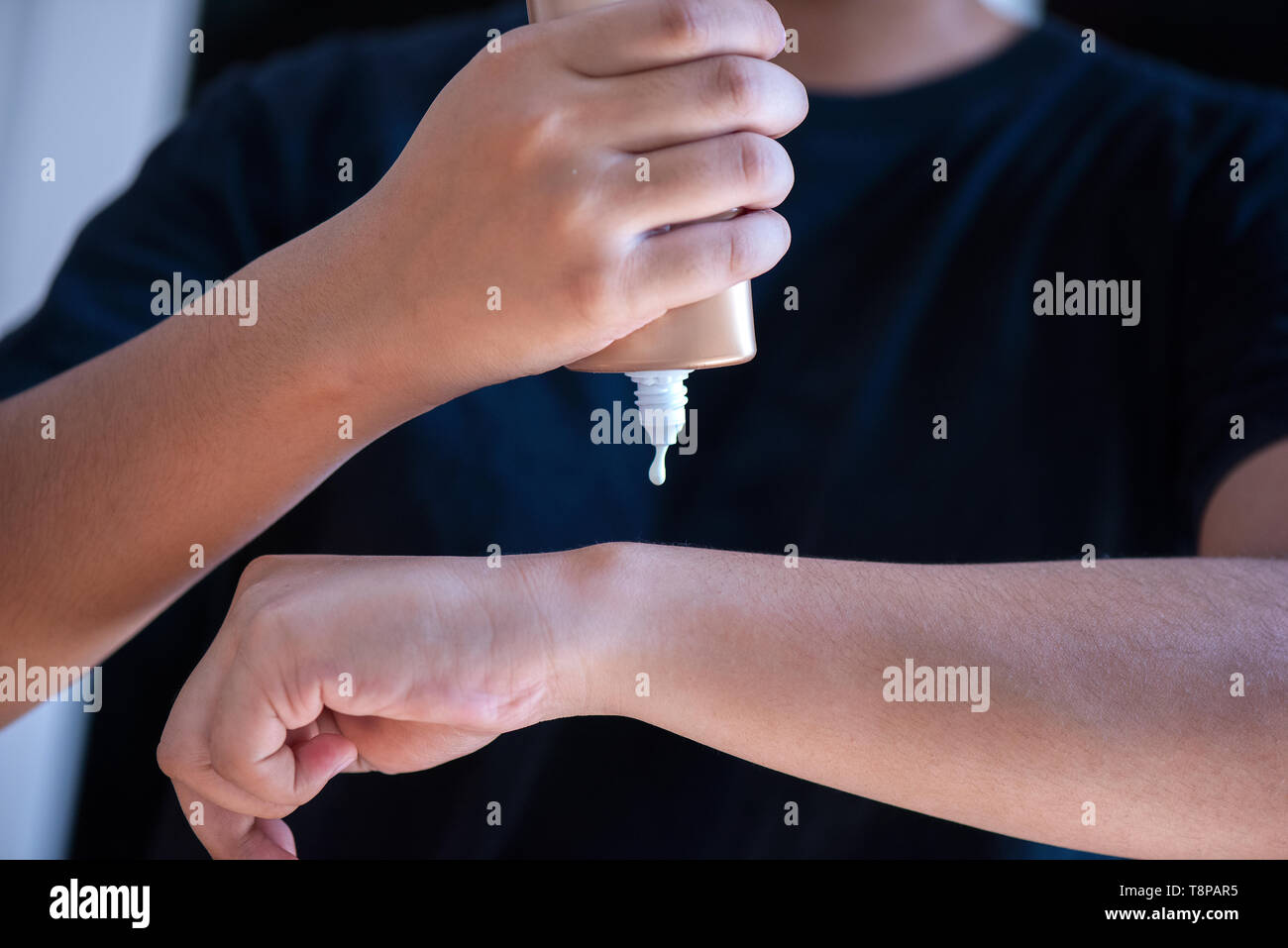 applying moisturizing cream on hands Stock Photo Alamy