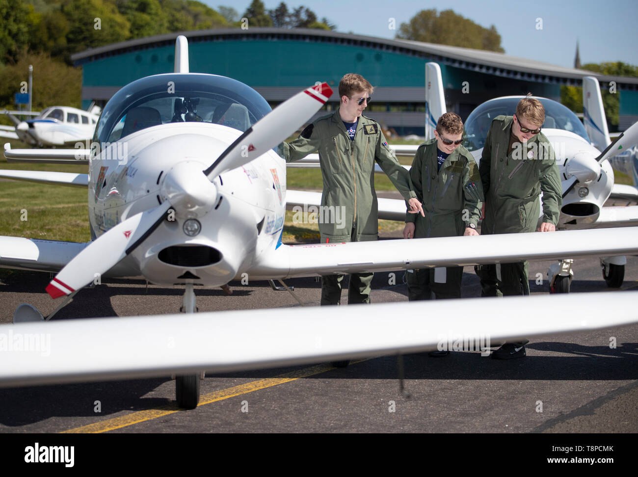 RAF cadets (from left) Arthur Chandler, Barney Jones-Evans and Joel Pilkington help to unveil a quartet of aircraft commemorating one of the most poignant tales of wartime Britain which they'll be learning to fly in at Tayside Aviation, Dundee. Stock Photo