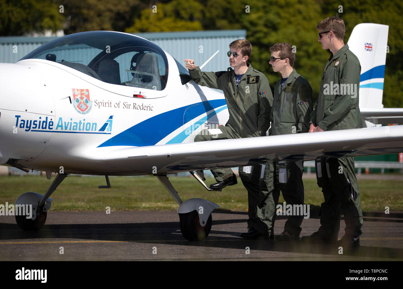 RAF cadets (from left) Arthur Chandler, Barney Jones-Evans and Joel Pilkington help to unveil a quartet of aircraft commemorating one of the most poignant tales of wartime Britain which they'll be learning to fly in at Tayside Aviation, Dundee. Stock Photo