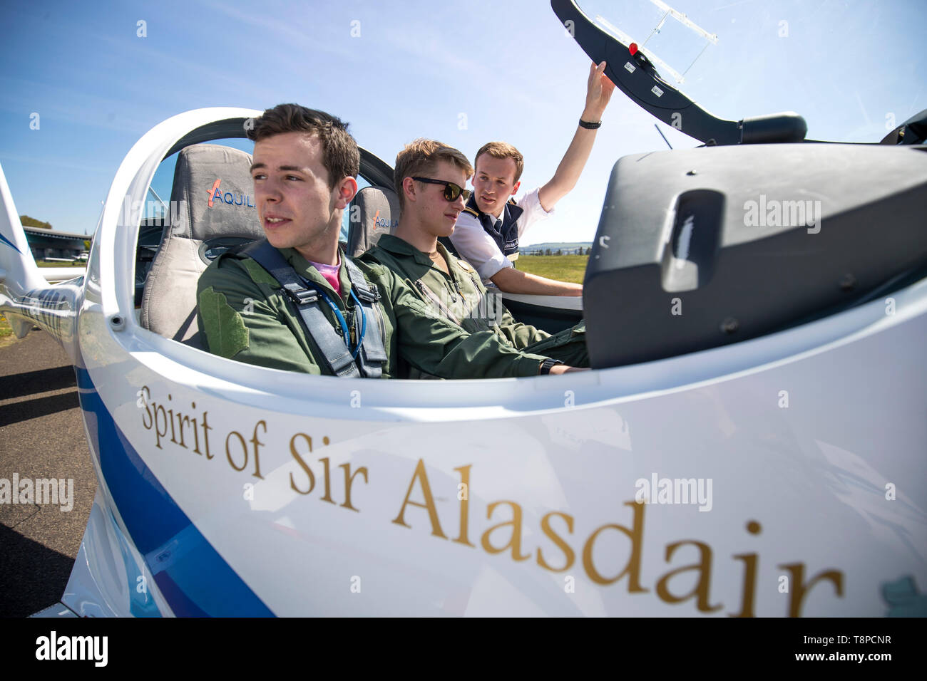 (left to right) RAF cadets Ben Hunter and Joel Pilkington, with instructor Gareth Hutchison, check over a quartet of aircraft commemorating one of the most poignant tales of wartime Britain which they'll be learning to fly in at Tayside Aviation, Dundee. Stock Photo