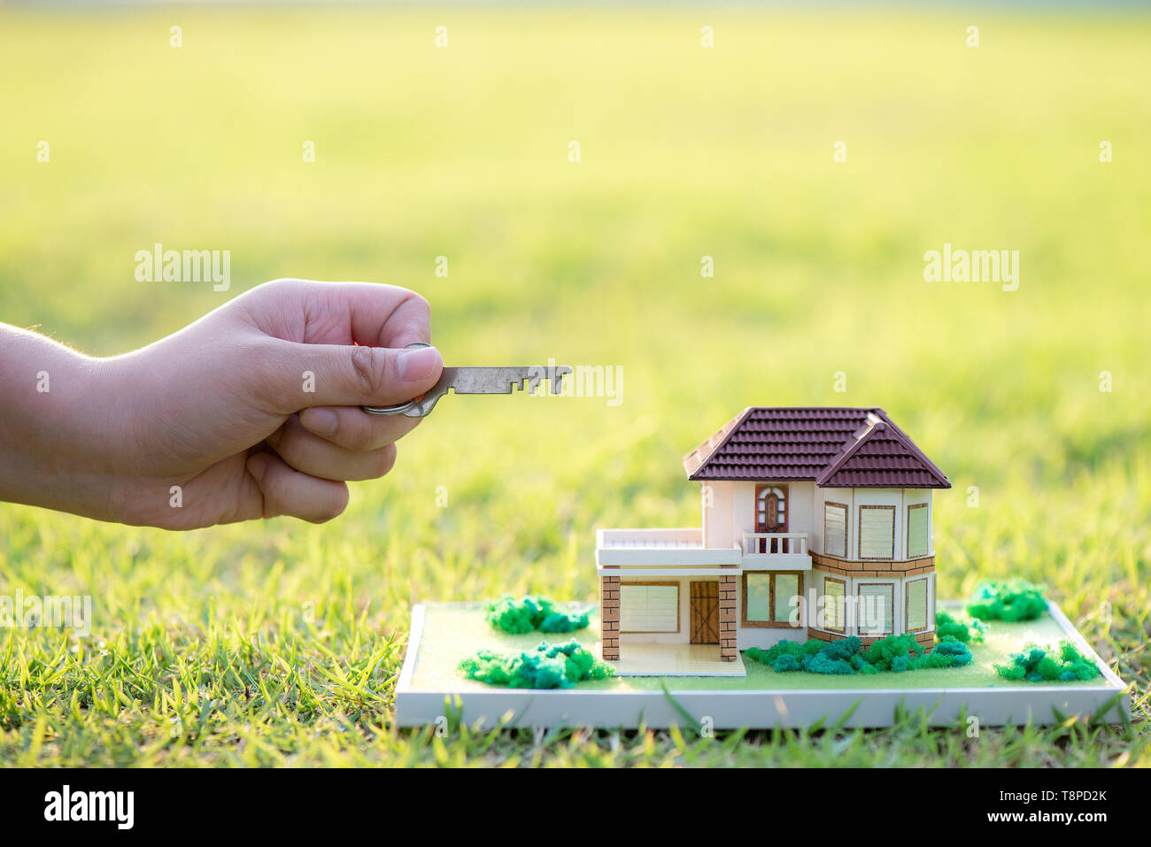 hand holding model house and keys Stock Photo - Alamy