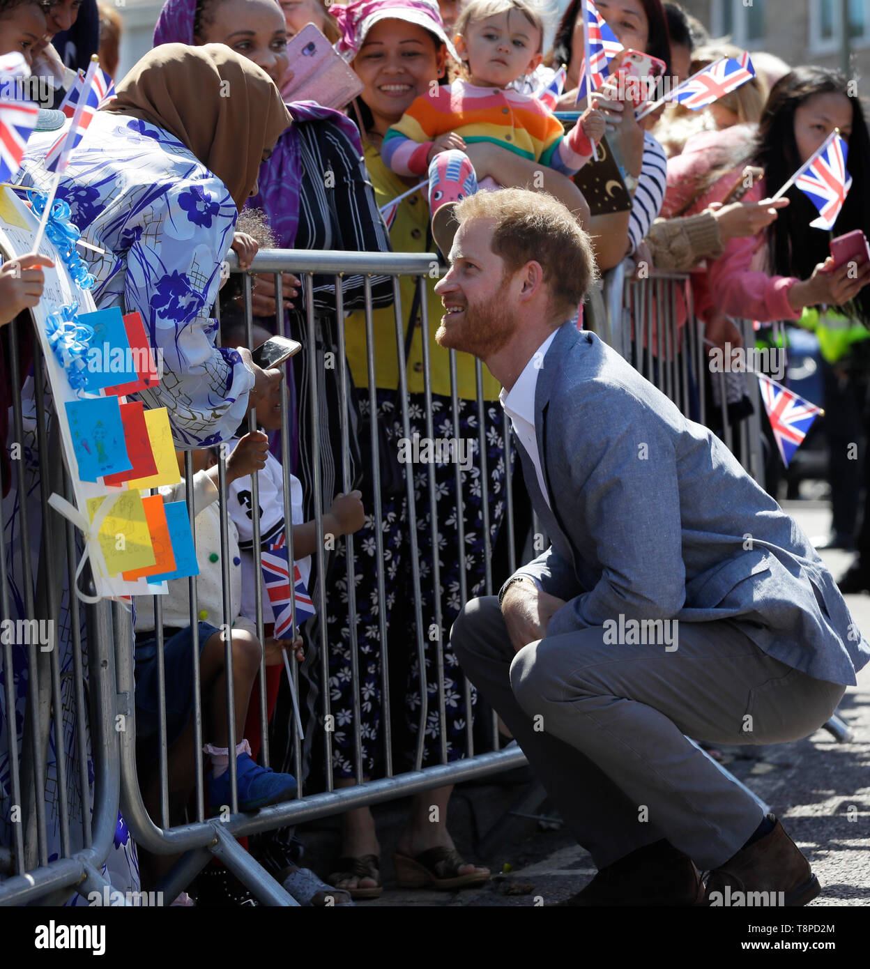 The Duke of Sussex meets children in the crowd as he arrives for a visit to the Barton Neighbourhood Centre in Oxford. Stock Photo