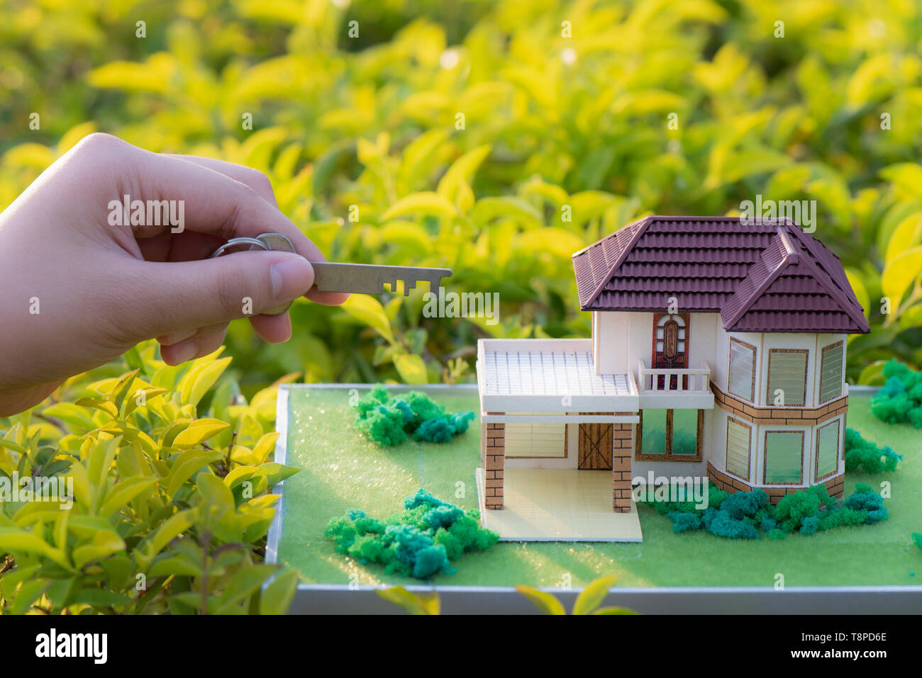 hand holding model house and keys Stock Photo - Alamy