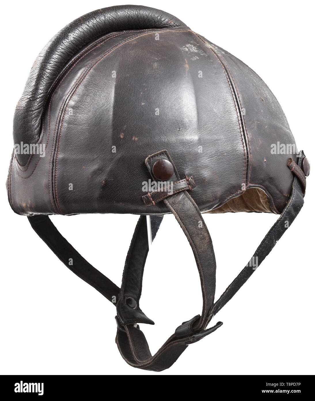 A steel flight helmet Baumuster SSK 90 Skull of riveted steel plates with brown leather cover, protective bulge sewn and padded, attachment loops. Chinstraps of a different colour, with press button attachment. The lining made from the same sand-coloured mottled linen as the flying suits, with sewn maker's label 'Siemens - Baumuster SSK 90 - Hersteller Luftfahrtgerätewerk Hakenfelde GMBH - Striwa - Kopfgröße 60-62' (tr. 'Siemens - model SSK 90 - manufacturer Luftfahrtgerätewerk Hakenfelde GMBH - Striwa - head size 60-62'). historic, historical, Air Force, branch of service,, Editorial-Use-Only Stock Photo