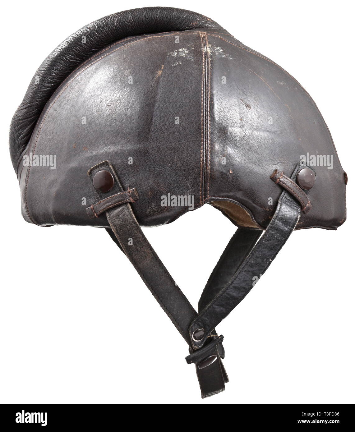 A steel flight helmet Baumuster SSK 90 Skull of riveted steel plates with brown leather cover, protective bulge sewn and padded, attachment loops. Chinstraps of a different colour, with press button attachment. The lining made from the same sand-coloured mottled linen as the flying suits, with sewn maker's label 'Siemens - Baumuster SSK 90 - Hersteller Luftfahrtgerätewerk Hakenfelde GMBH - Striwa - Kopfgröße 60-62' (tr. 'Siemens - model SSK 90 - manufacturer Luftfahrtgerätewerk Hakenfelde GMBH - Striwa - head size 60-62'). historic, historical, Air Force, branch of service,, Editorial-Use-Only Stock Photo
