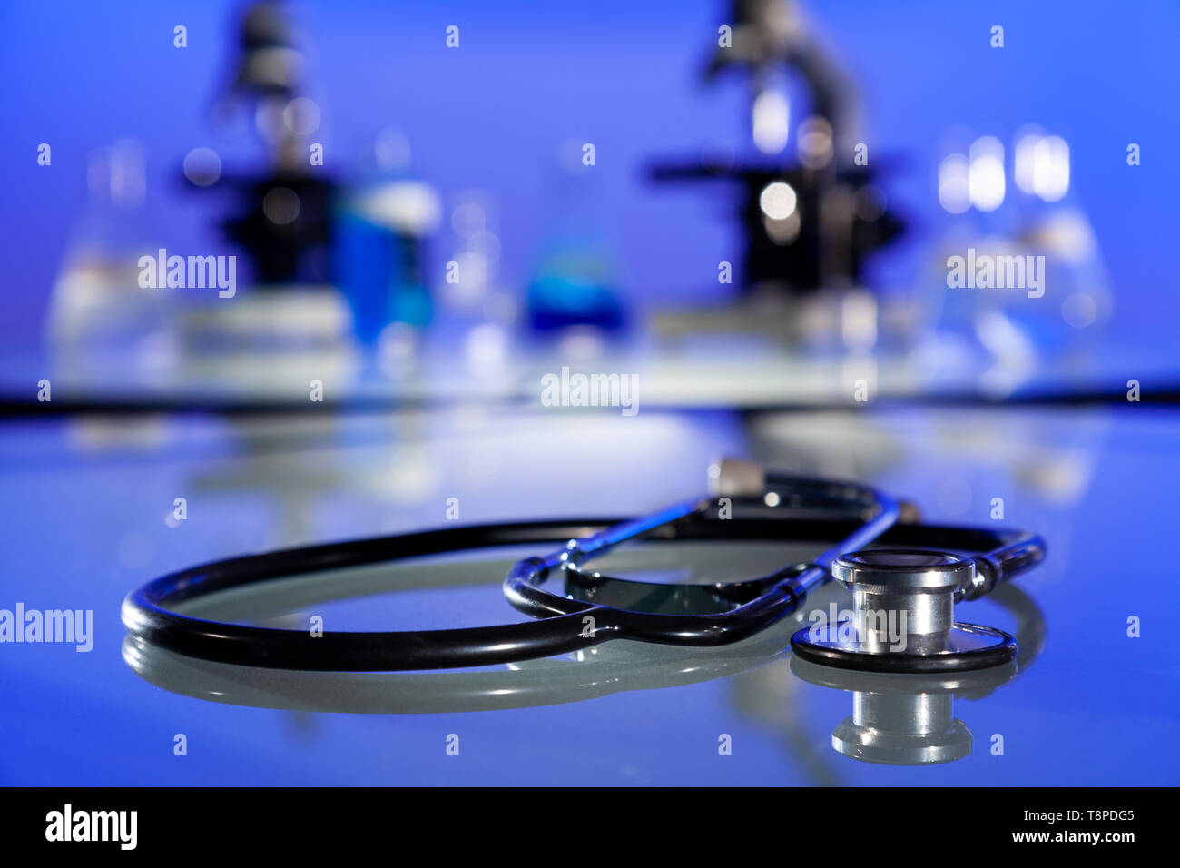 Stethoscope, microscopes and medical equipment in a hospital laboratory environment Stock Photo