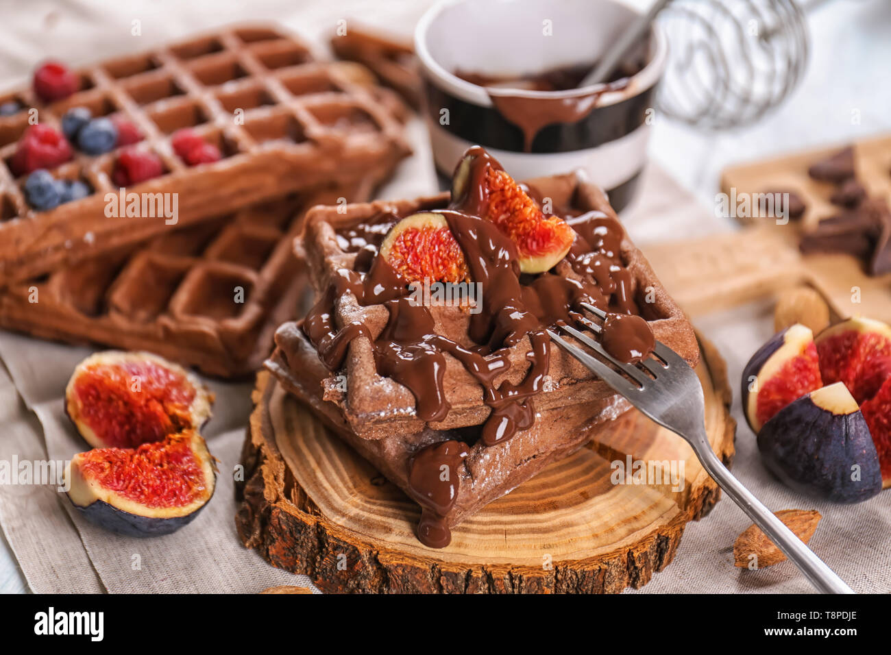 Delicious Waffles With Fig Slices And Chocolate Sauce On Wooden Board Stock Photo Alamy Delicious Waffles With Fig Slices And Chocolate Sauce On Wooden Board Stock Photo Alamy