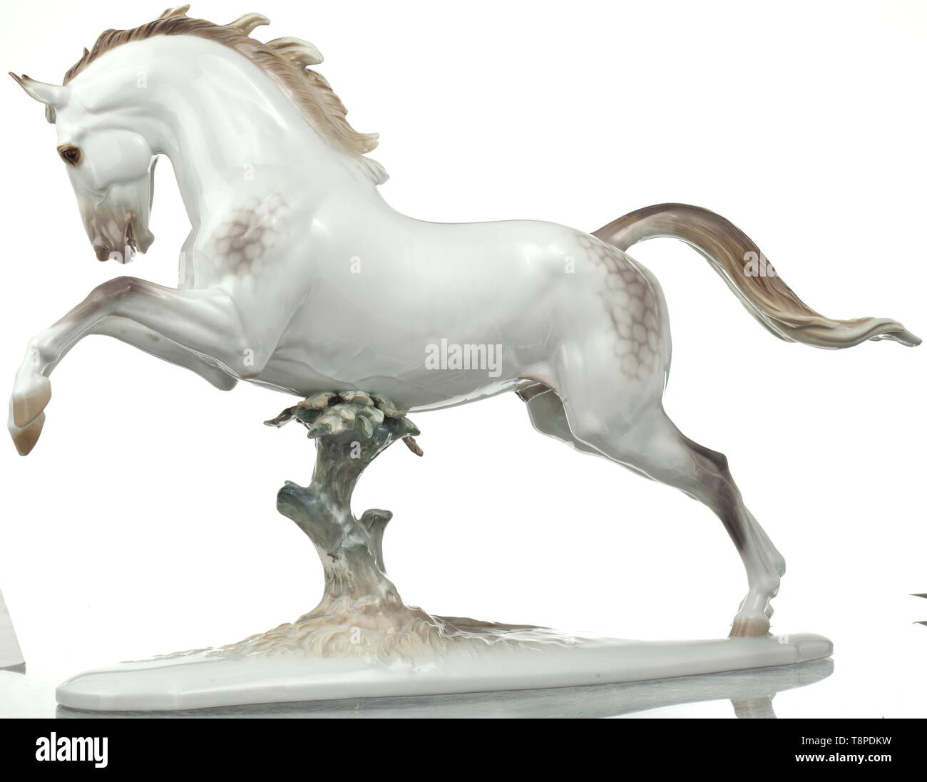 Rampant horse in polychrome version Design by Prof. Theodor Kärner, model number '74'. Polychrome glazed porcelain. The artist's signature, model number and manufacturer's mark 'SS' within an octagon on the bottom. Excellent state of preservation, unrestored. Height circa 33 cm. An extremely rare animal figure by the PMA. According to Porell, the three polychrome variants were only produced in 1939 (Porell, Allach Porcelain, vol. II, 2010, p. 431). historic, historical, porcelain, chinaware, 20th century, Editorial-Use-Only Stock Photo