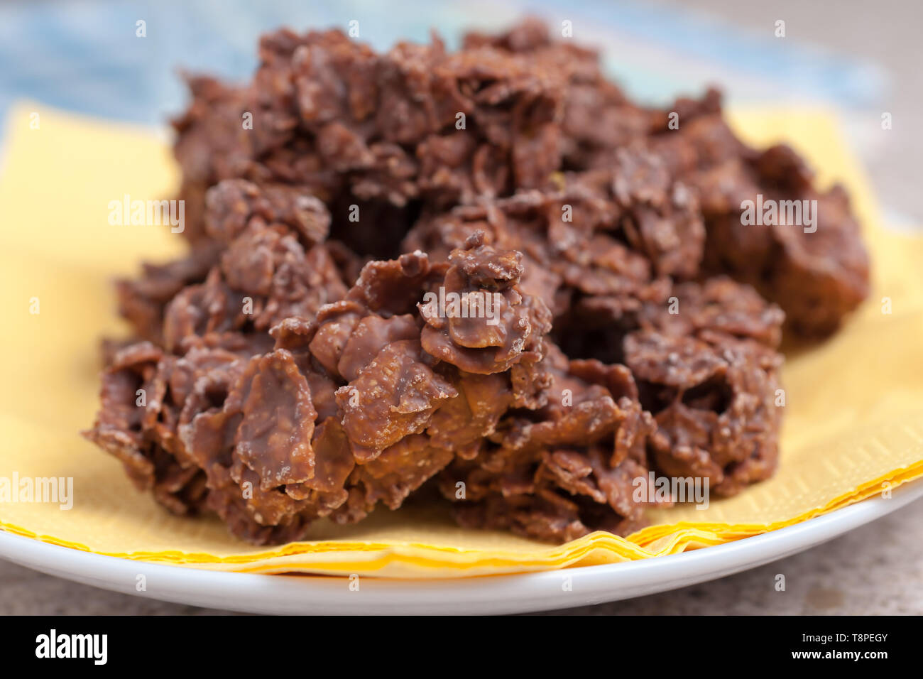 Chocolate corn flake cakes a simple party cake recipe for children to make Stock Photo