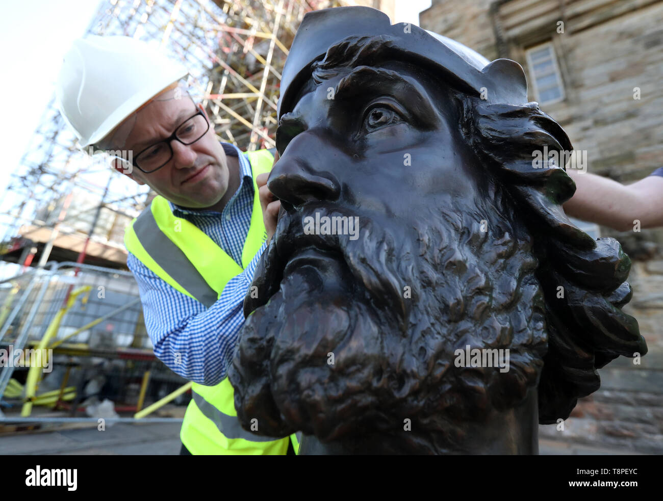 Drew Leslie from Stirling Council with part of the bronze statue of William Wallace which is being returned to the National Monument in Stirling after undergoing vital restoration work. Stock Photo