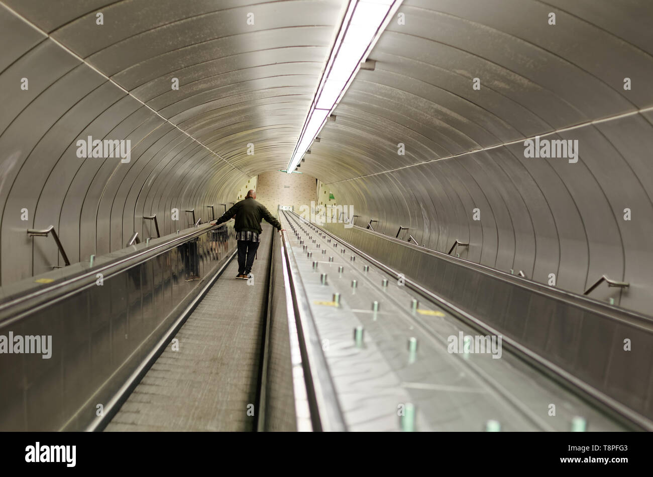 Quebec,Caanada. A man going down an escalator at the Beaudry subway station in Montreal Stock Photo