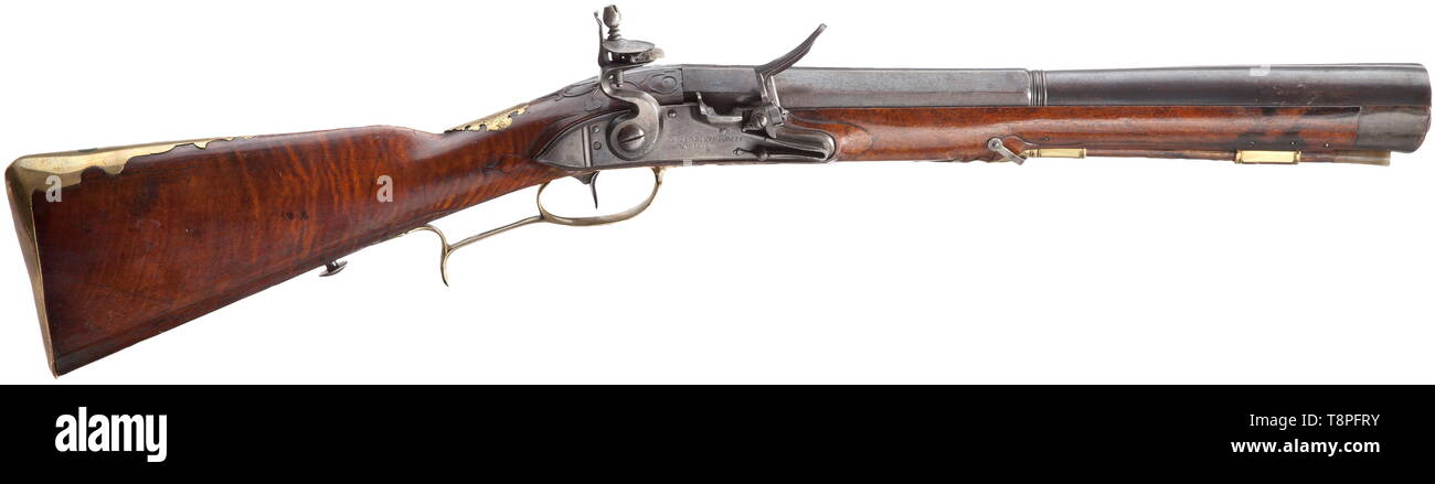 A flintlock blunderbuss, Nicolaus Koch, Vienna, circa 1730 Strong two-stage barrel, octagonal then round after a girdle, with oval muzzle. At the breech a brass-filled mark 'KOCH', the tang numbered '1'. Smooth flintlock with foldout frizzen on the side, signed on the lock plate 'NICOLAUS KOCH IN WIENN'. Beautiful walnut full stock with horn nose and smooth brass furniture, the wooden ramrod with horn tip. The brass escutcheon with finely engraved coat of arms, surrounded by the continuous device 'CONSTANT FI DE SIN CERITATE'. Blunderbuss of unus, Additional-Rights-Clearance-Info-Not-Available Stock Photo