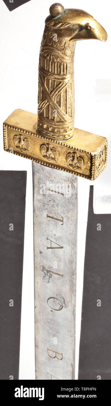 Air Marshal Italo Balbo - a gift sword of the Camicie Nere (Blackshirts) Made in the style of a Roman gladius of Pompeii type. The broad blade with deeply engraved and gilt dedication 'Italo Balbo' and 'Al Governatore Generale della Libia le Camicie Nere D'Africa offrono Tripoli Gennaio 1934'. Gilt eagle head grip of the Roman imperial swords, applied to the box-shaped cross-guard Savoy eagles sitting on fasces. The black leather covered scabbard (losses) tied with laces, applied brass mounts. Length 65 cm. Gilding partially over-polished. Italo Balbo, 1896 - 1940, head of , Editorial-Use-Only Stock Photo