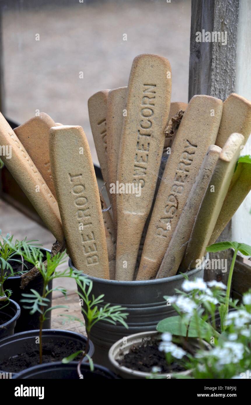 Ceramic handmade plant tags stored in metal plant pot Stock Photo Alamy