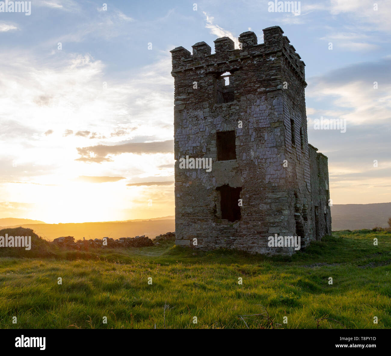 Toe Head, Cork, Ireland, 14th May 2019, Sunset behind the ruins of the old Napoleonic watch tower on the tip of Toe Head, West Cork Credit aphperspective/ Alamy Live News Stock Photo