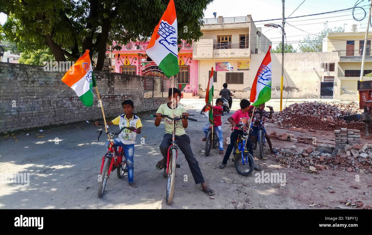 May 14, 2019 - Patiala, Punjab, India - Supporters of the Indian's Congress Party are seen riding bicycles with the party flags during an election campaign in Patiala district of Punjab..The 2019 Indian general election will be held in Punjab on 19 May 2019, making it the seventh and the last phase of the general election. (Credit Image: © Saqib Majeed/SOPA Images via ZUMA Wire) Stock Photo