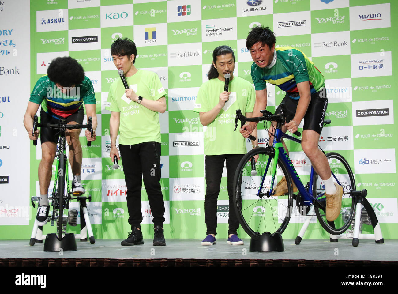 Tokyo, Japan. 14th May, 2019. Japanese comedy duo Total Ten Bosch member Kensuke Fujita (L) and comedy trip Panther member Takahiro Ogata (R) fight on bicycles as they attend a promotional event of the Tour de Tohoku 2019 fun ride in Tokyo on Tuesday, May 14, 2019. Tour de Tohoku is is an annual cycling event to support Tohoku region, northern Japan as a massive earthquake and tsunami attacked the region in 2011. Credit: Yoshio Tsunoda/AFLO/Alamy Live News Stock Photo