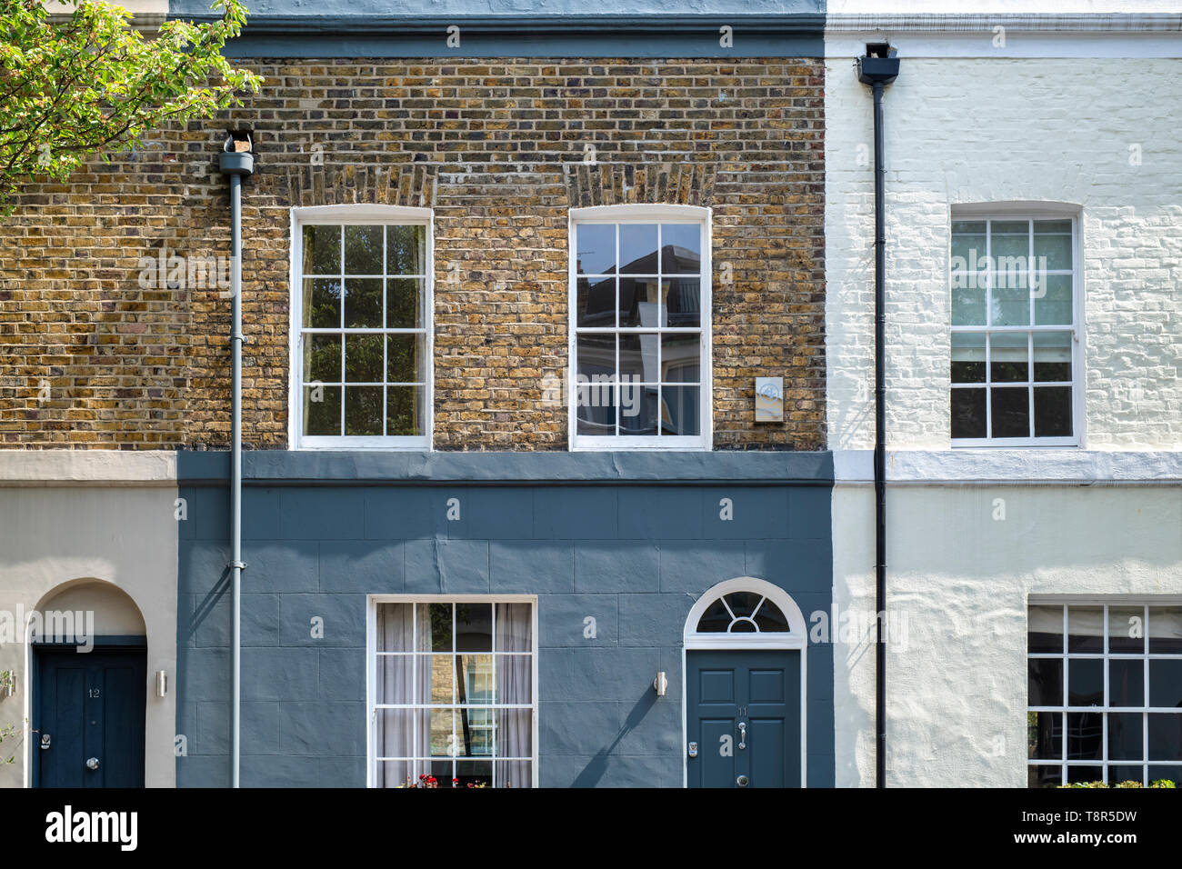 A Row of Brick Buildings with Black Doors on a Street in London Stock Image  - Image of architecture, english: 189002149