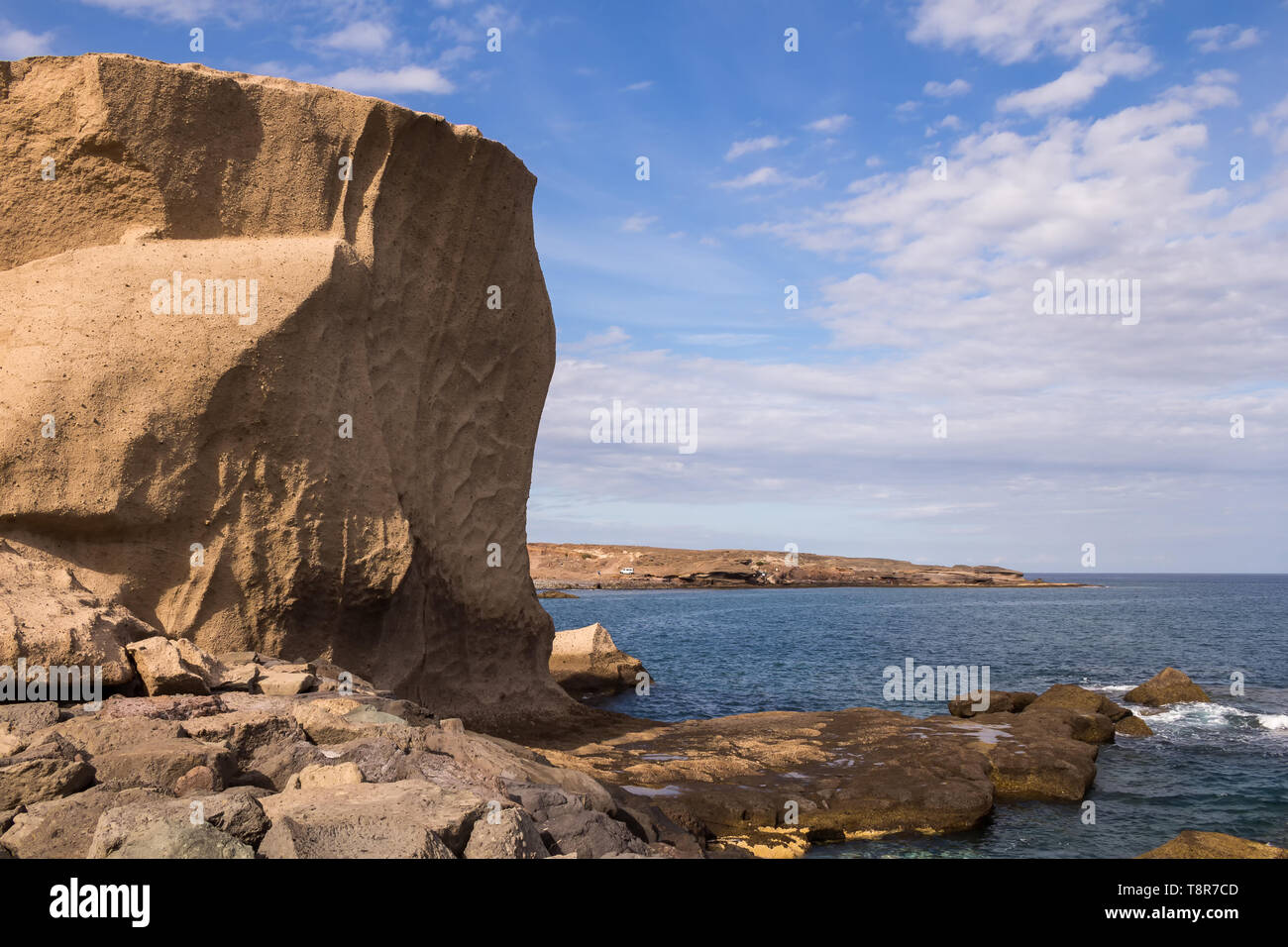 Sandstone, creating original rocks of tender shape. Calm Atlantic ocean ...