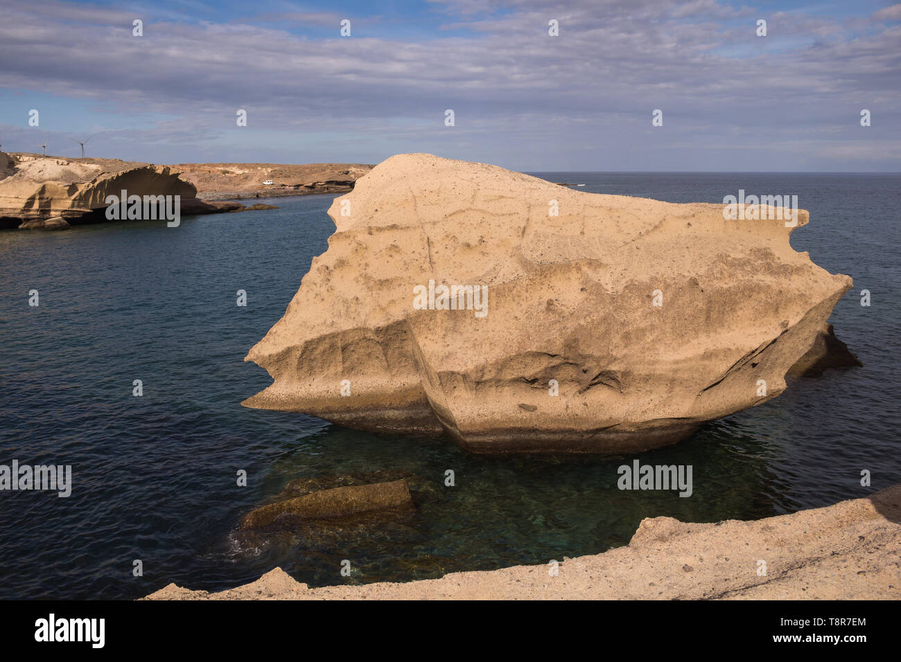 Sandstone, creating original rocks of tender shape. Calm Atlantic ocean ...
