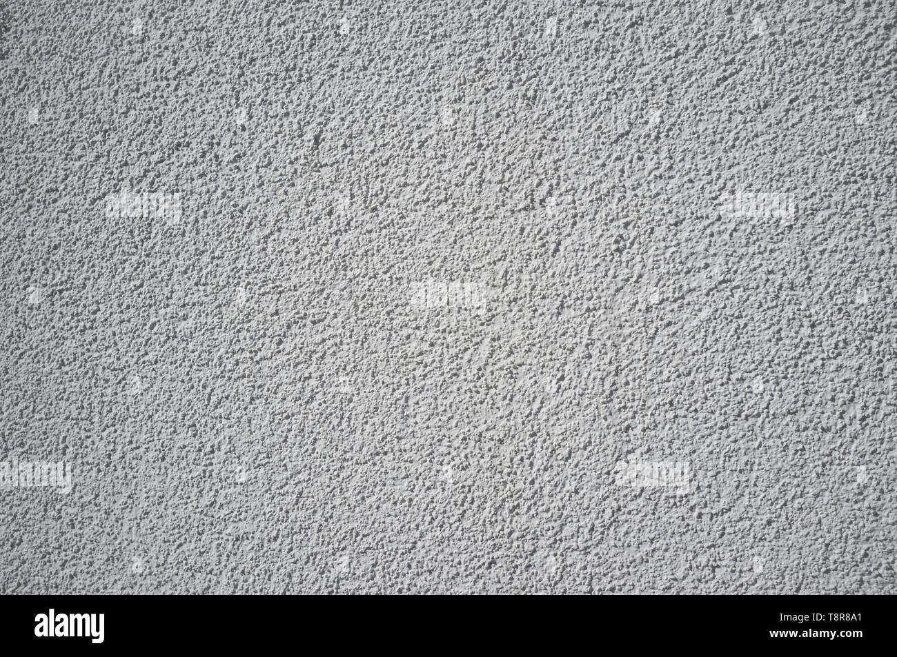 Monochromatic Grainy Texture of Plaster Wall on Bright Sun Stock Photo