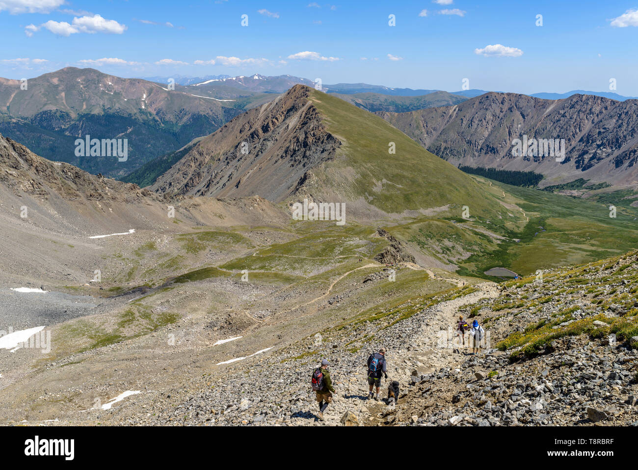 Summer Mountain Hiking Trail - Hikers on a rocky and steep trail at base of Grays Peak in Front Range of Colorado Rockies, USA. Stock Photo