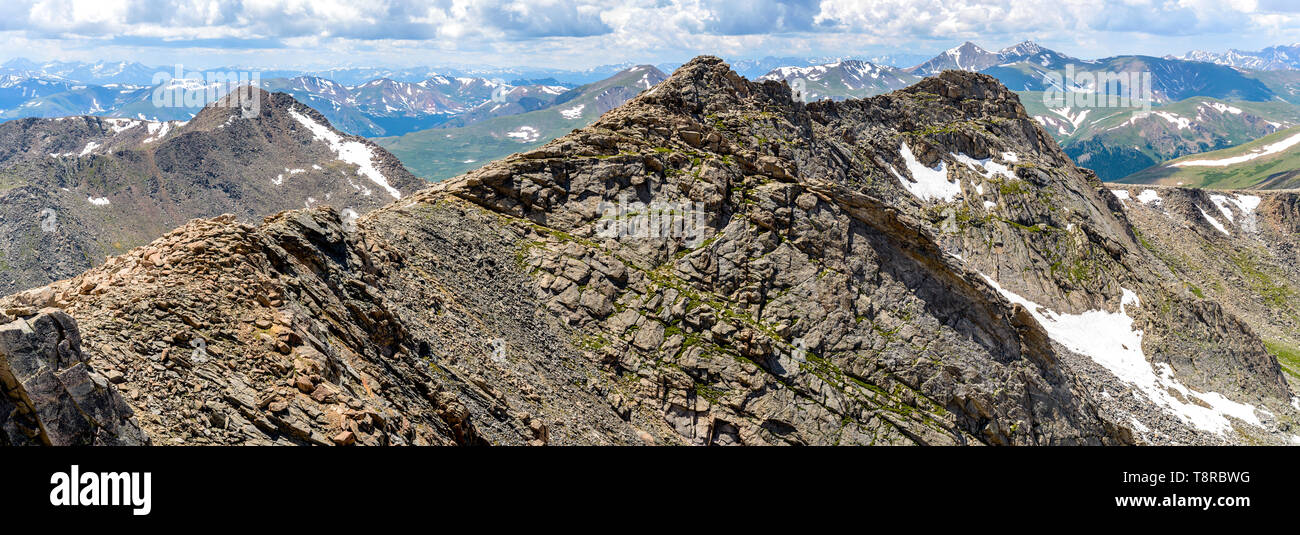 Rugged Mountains - Panorama of rugged west ridge of Mt. Evan, humble Mt. Bierstadt, and rolling high peaks of Front Range of Colorado Rockies. CO, USA. Stock Photo