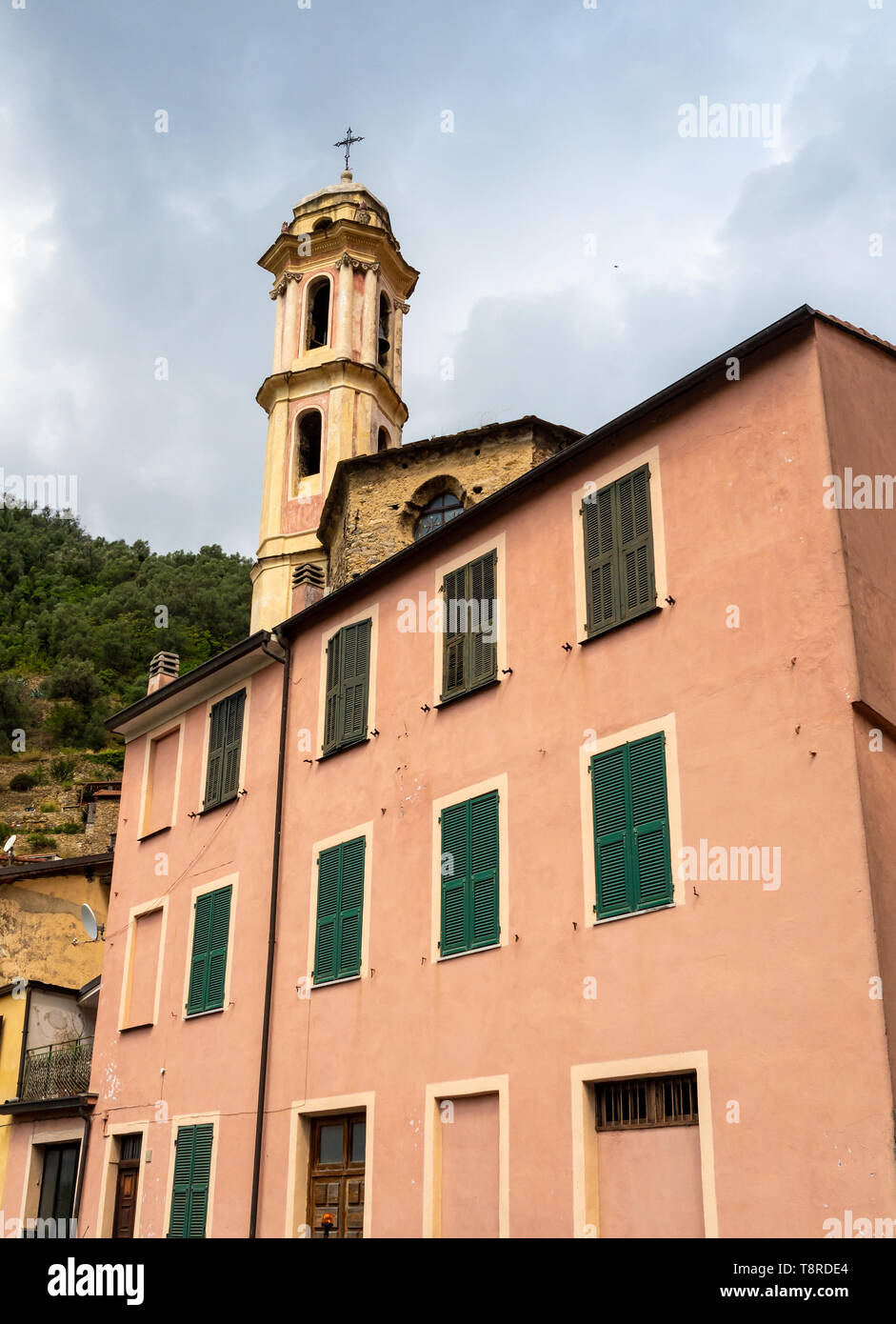 view of typical building and bell tower in Badalucco Liguria, Italy in summer Stock Photo