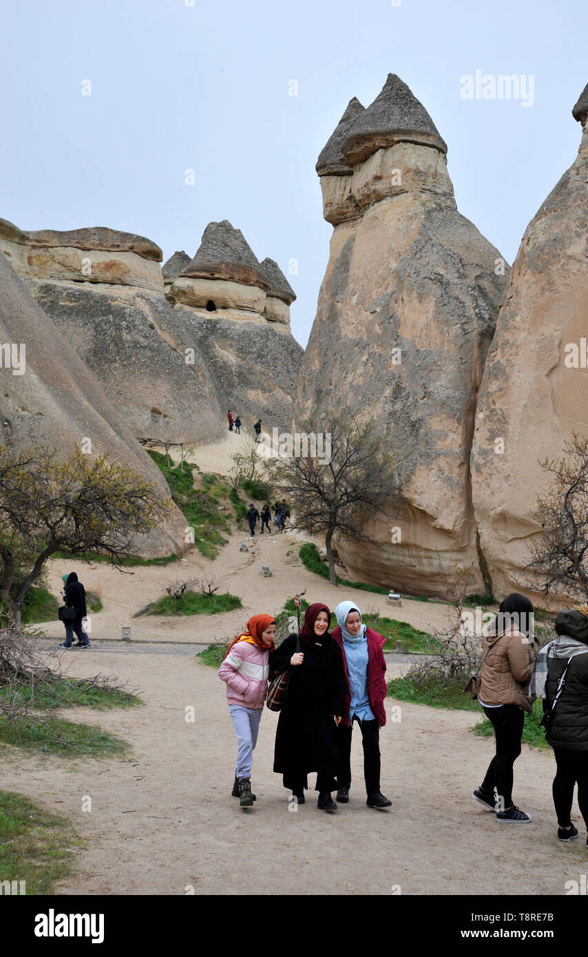 A group of young Muslim women visiting outdoor museum in Cappadocia, Turkey Stock Photo