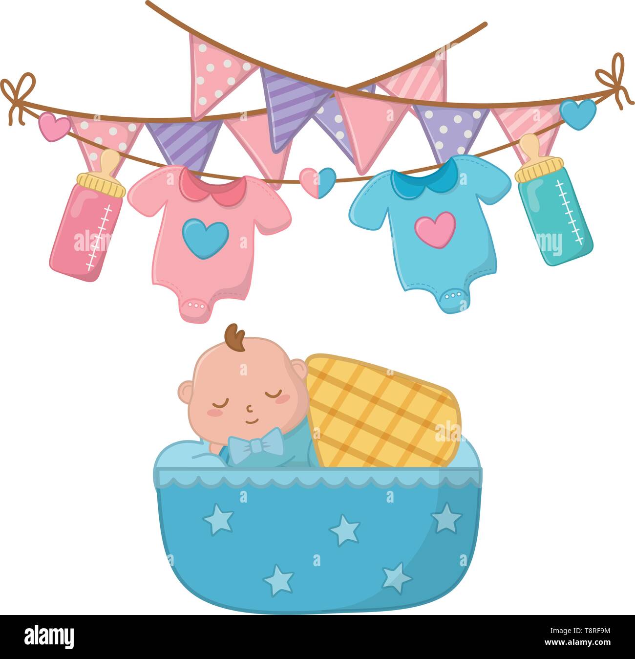 baby sleeping in a cradle with blanked and baby clothes hanging on ...