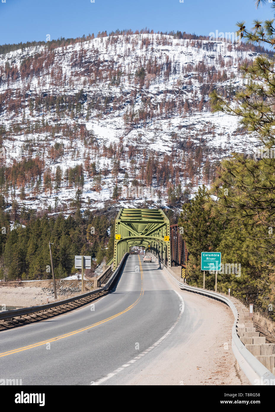 State Highway 20, US Highway 395 and the railroad cross Lake Roosevelt at Kettle Falls, Washington on Steel Truss Bridges in the early spring Stock Photo