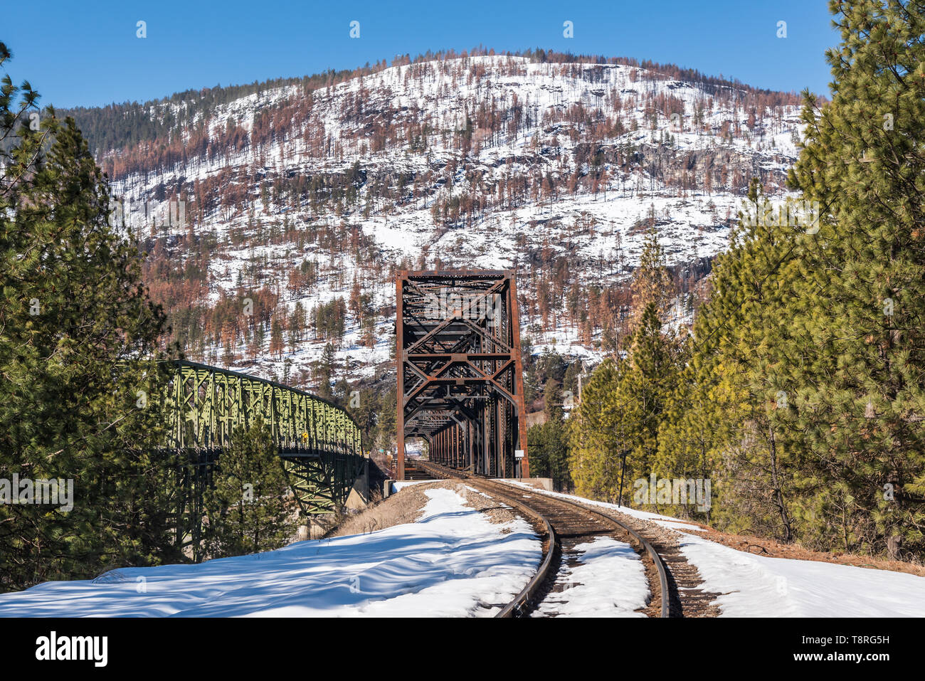 State Highway 20, US Highway 395 and the railroad cross Lake Roosevelt at Kettle Falls, Washington on Steel Truss Bridges in the early spring Stock Photo
