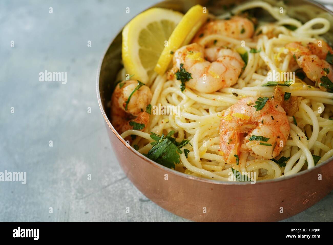 Homecooked Shrimp Scampi with Spaghetti pasta and lemon, selective focus Stock Photo