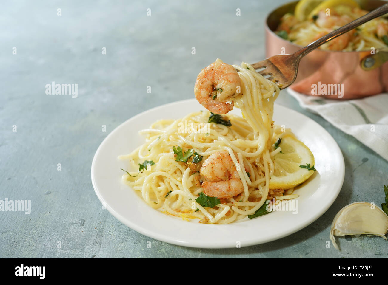 Homecooked Shrimp Scampi with Spaghetti pasta and lemon, selective focus Stock Photo