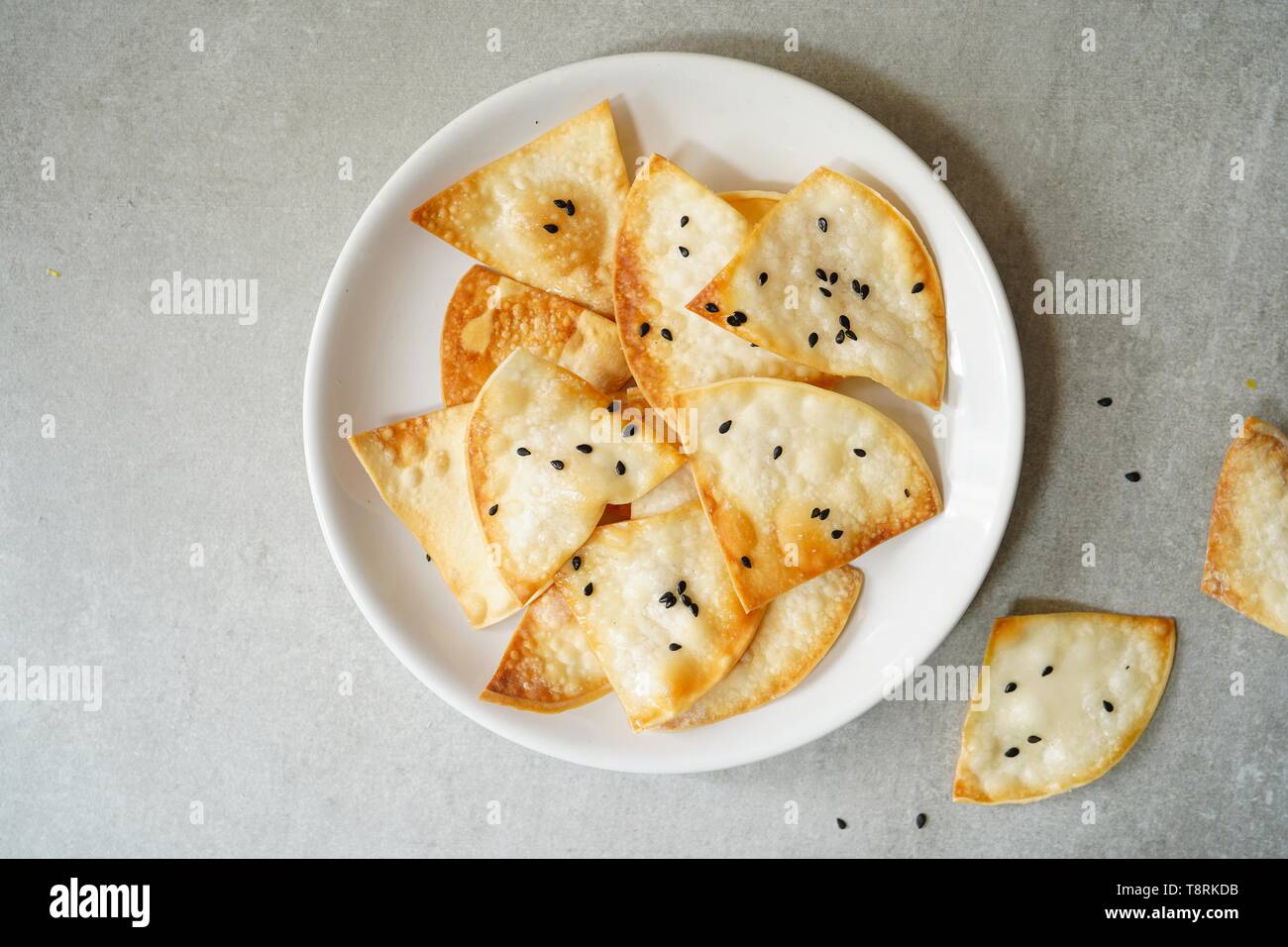 Homemade Wonton Crisps / Chips or Crackers, selective focus Stock Photo