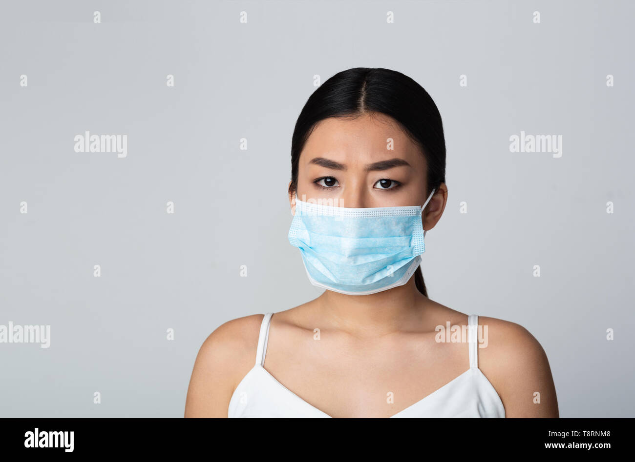 Air Pollution Concept. Girl Wearing Face Protective Mask Stock Photo