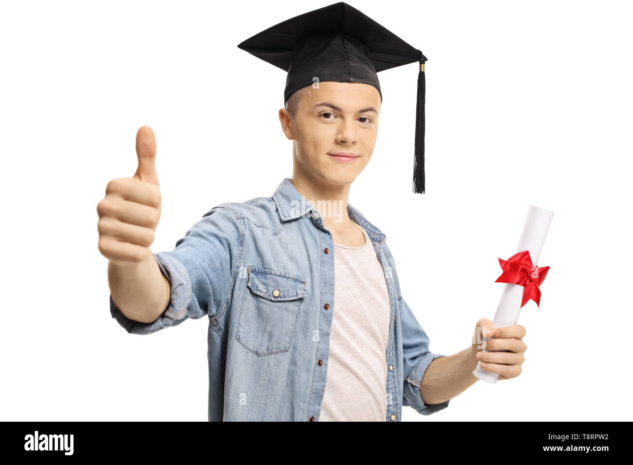Male student with a graduation cap and diploma showing thumbs up isolated on white background Stock Photo