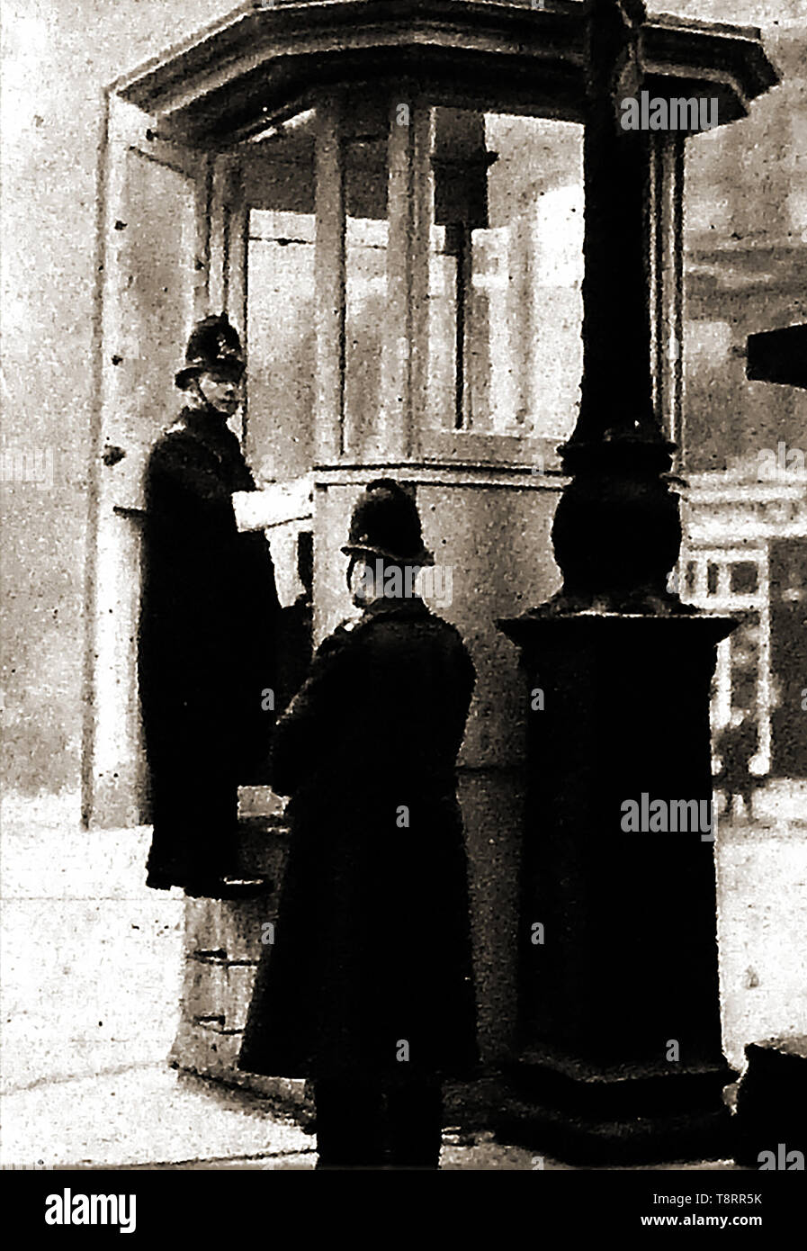 An early historic photograph showing a police-box at Ludgate circus, London where police officers controlled traffic lights. Stock Photo