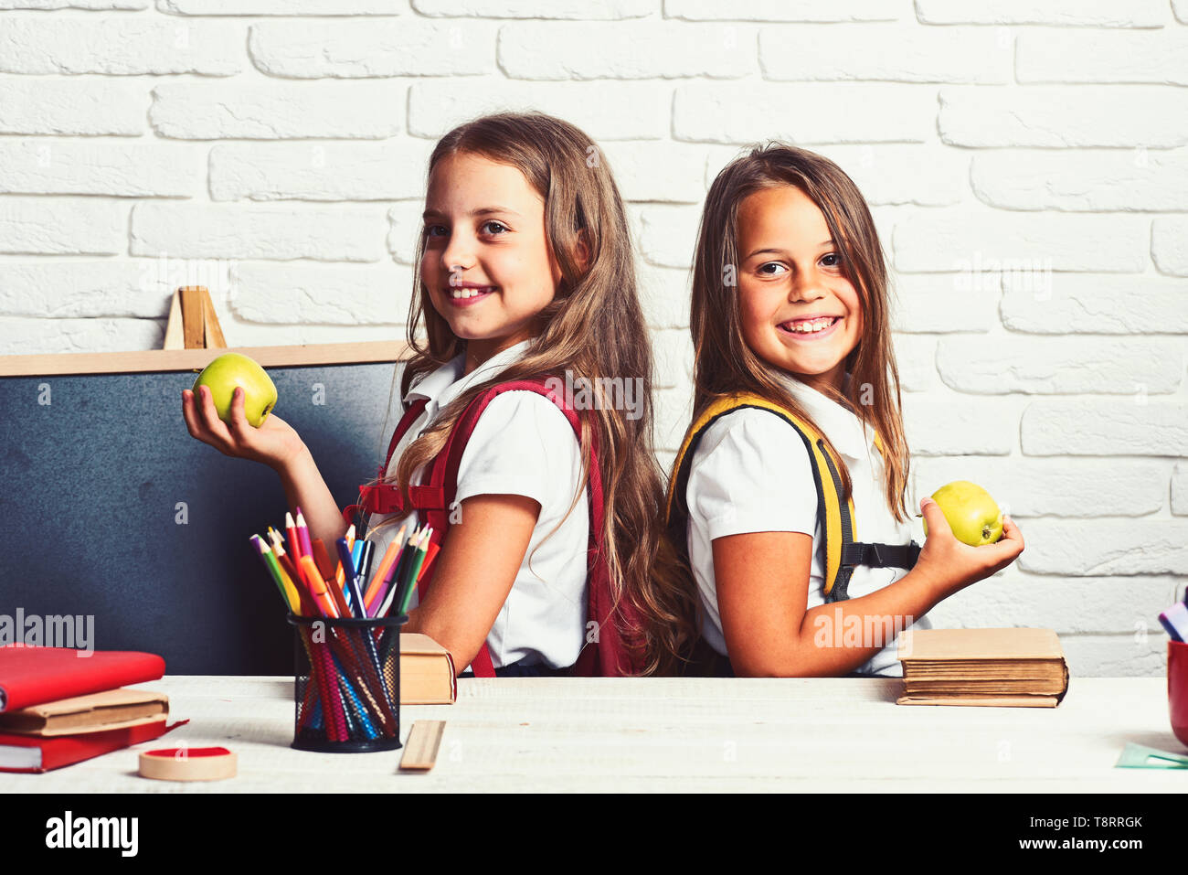 elementary school kids sitting at school lesson Stock Photo - Alamy