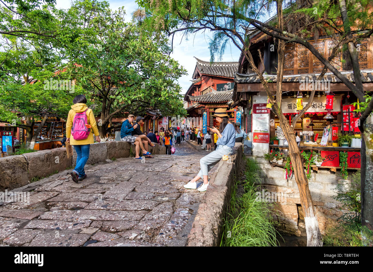 Lijiang, China - April 26, 2019: View of the old town with chinese tourist. Old town is an UNESCO World Heritage Site Stock Photo