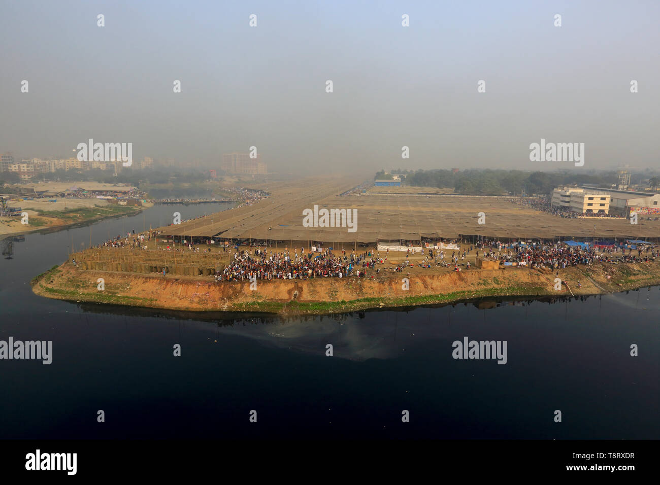 Tents are being pitched on the bank of river Turag to accommodate Muslims who will participate in Biswa Ijtema, the second largest religious congregat Stock Photo