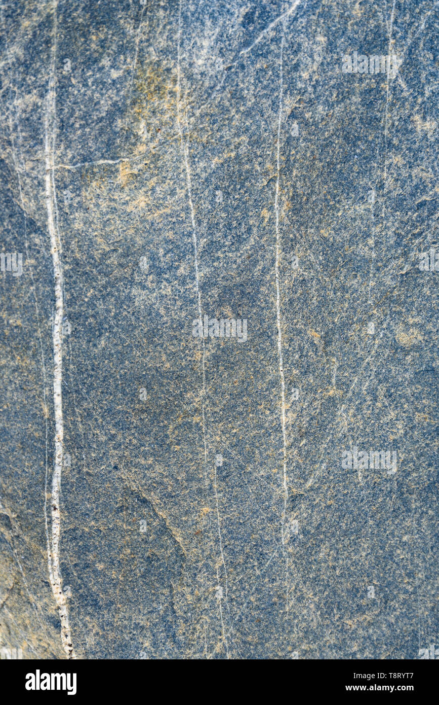 Blue gray stone with white lines of pattern and texture as a nature