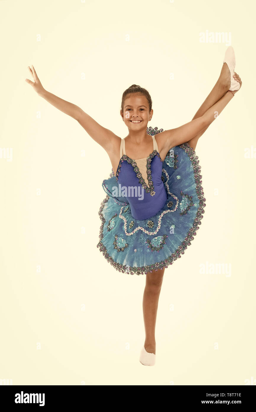 Kid blue dress with ballet skirt white background isolated. Child flexible  pupil practice dancing. Dream of every girl to become famous ballet dancer.  Child tender dancer look gorgeous fancy leotard Stock Photo -