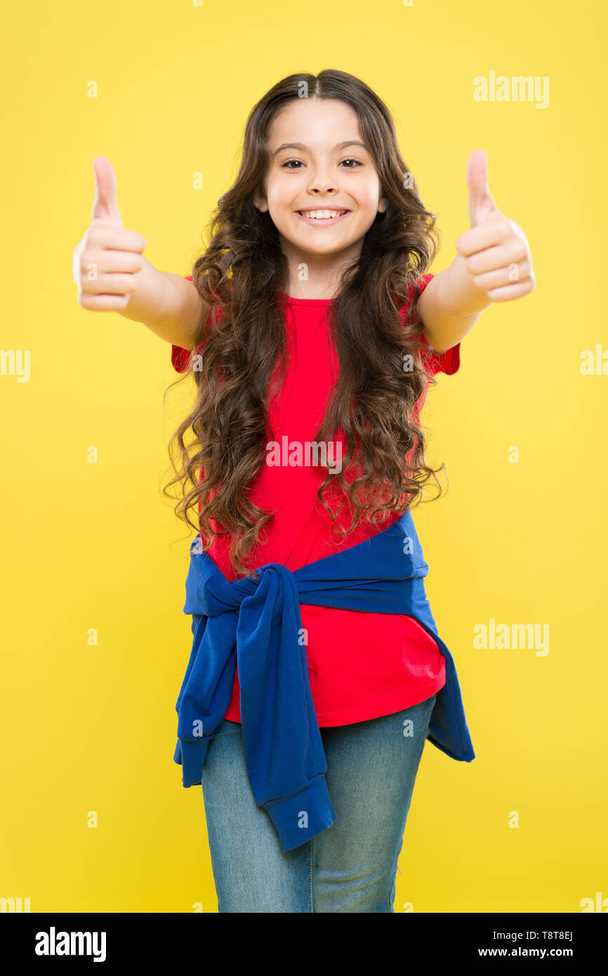 Perfect curls. Kid cute face with adorable curly hairstyle. Little girl  grow long hair. Teen fashion model. Styling curly hair. Change you can see.  Hairdresser tip. Kid girl long healthy shiny hair