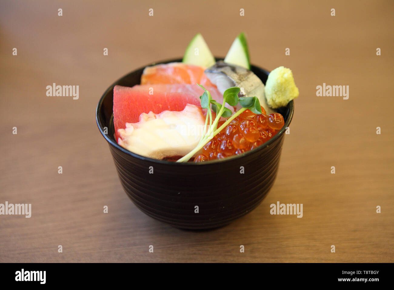 Sushi don , raw salmon tuna octopus on rice Stock Photo Alamy